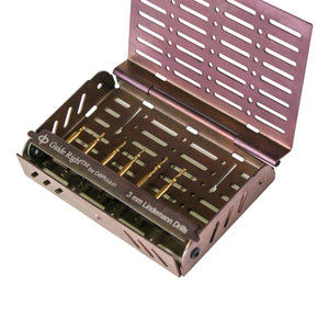 A open maroon rectangular metal box with 8 sizes of gold drills. The box says ‘Guide Right™ by DePlaque, 3.0 millimeter Lindemann Depth Stop Drills.